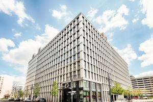 a tall white building on a city street at Premier Inn Berlin Alexanderplatz in Berlin