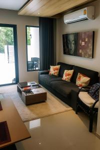 Posezení v ubytování Appartement 2 Chambres Tropical Sûr et Économique