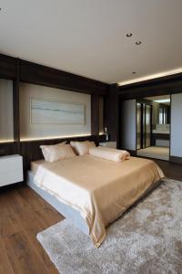 a bedroom with a large bed in a room at The Indigo Courtyard Hanoi-Elegant Loft-Steps from Old Quarter in Hanoi