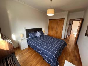 Ένα ή περισσότερα κρεβάτια σε δωμάτιο στο Vila do Conde Beach Apartment