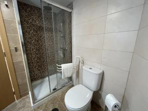 a bathroom with a toilet and a shower at Vila Mena by Trip2Portugal in Gonçalo Bocas +46 photos