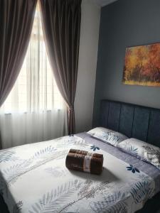 Postel nebo postele na pokoji v ubytování Nur Homestay Bandar Putra Kuantan