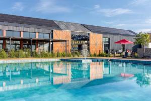 a large swimming pool in front of a building at Your Perfect home-away-from -home Retreat in Sandton