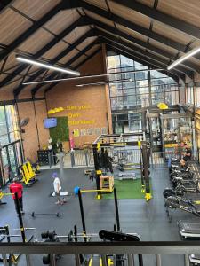a gym with a lot of equipment and people in it at Your Perfect home-away-from -home Retreat in Sandton