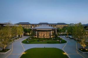 an aerial view of a building with a park at Renaissance Hangzhou Lin'an Hotel in Hangzhou