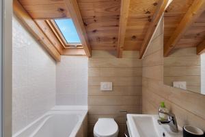 a bathroom with a tub and a toilet and a sink at Maison de village Ramballade in Les Angles +18 photos