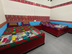 Postel nebo postele na pokoji v ubytování Rann bhumi villa + 9 fotografií