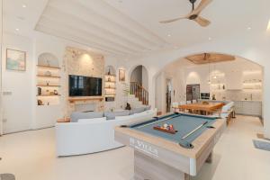 a living room with a pool table at Ha Long 4BRS Beach Villa With Pool, Jacuzzi and Sauna in Ha Long