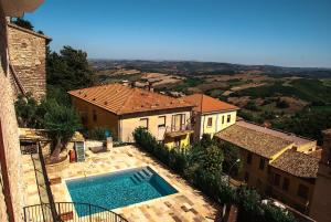 a view of a house with a swimming pool at Rocca Contrada in Arcevia +24 photos