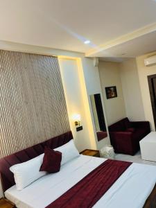 Voodi või voodid majutusasutuse Hotel Manglam toas