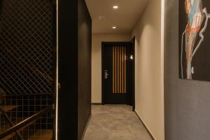 a hallway with a door to a wine cellar at Pou by Seaward Suites in Villajoyosa