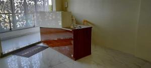 a room with a podium in the middle of a building at Hotel O Amrut Lodge in Sāsvad