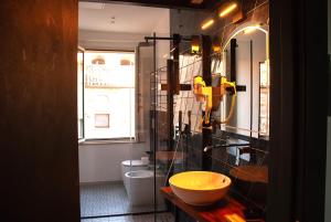 a bathroom with a sink and a toilet at Rocca Contrada in Arcevia