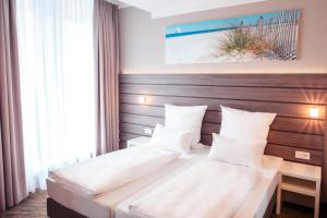 Postel nebo postele na pokoji v ubytování Tulip Inn München Messe