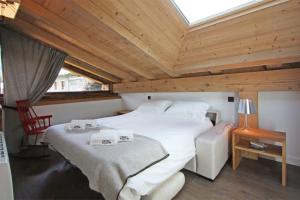 Ένα ή περισσότερα κρεβάτια σε δωμάτιο στο Chalet Les Praz - Chamonix All Year