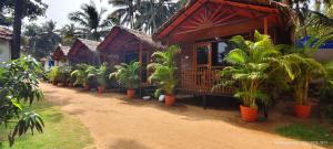 a row of houses with plants inront of them at Abba's Glory Land - Agonda in Agonda