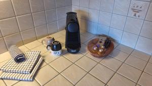 a kitchen counter with a phone on top of it at Centre Thermal - Studio SUD terrasse in Ovronnaz