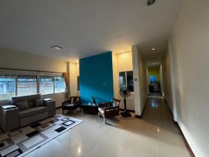 a living room with a couch and a table at Aonang Private Pink House 8 in Ao Nang Beach