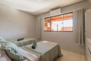 Postel nebo postele na pokoji v ubytování Refúgio com piscina privada - Caldas Novas + 50 fotografií