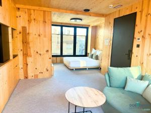 a living room with a couch and a table at Minimal Suites Mudéjar Eco Friendly by Dos Torres in Zaragoza