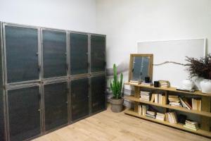 a room with a bunch of glass cabinets and a mirror at Apartamento Bguest in Alicante +10 photos
