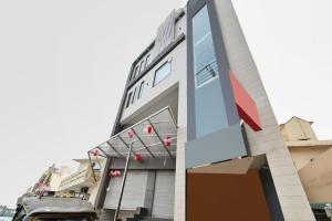 a building with a truck parked in front of it at Collection O Royal King in Rohtak