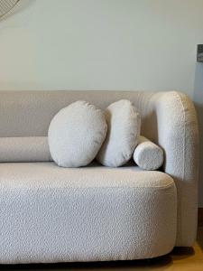two pillows sitting on top of a couch at Sea and Marina View - By AppartAli in Casablanca-Port