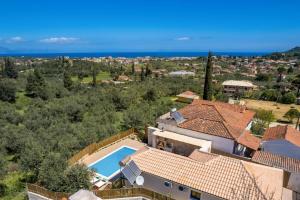 an aerial view of a house with a swimming pool at Villa Halakas by Villa Plus in Katastárion