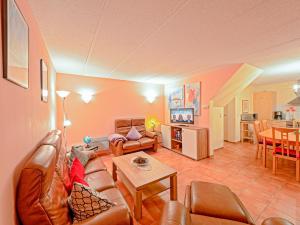 a living room with a couch and a table at Fischerhaus Rechlin in Zielow