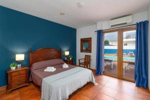 En eller flere senge i et værelse på Villa Silvia II by Villa Plus