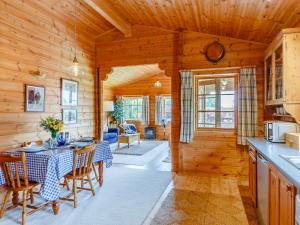 a kitchen and dining room with a table and chairs at 2 Bed in Blandford Forum 61027 in Child Okeford