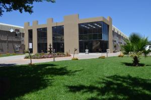 a large building with a lawn in front of it at Be My Guest Hotel Conference in Sasolburg