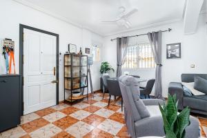a living room with a couch and a table at Siam's House in Villacosta