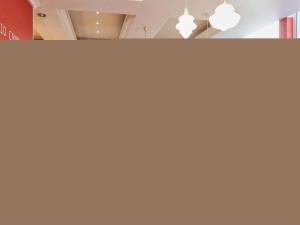 a room with two lights on a wall at Aparthotel Adagio Monaco Palais Joséphine in Beausoleil