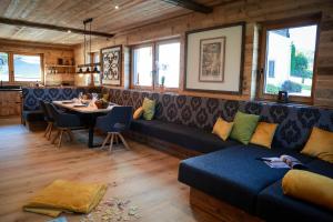 a living room with a couch and a table at Chalet Gipfelsturm in Haus im Ennstal