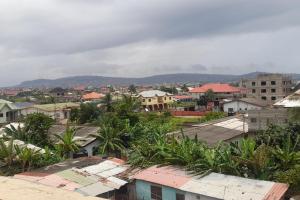 a view of a city with houses and trees at 1 Bed Apartment Sleeps 4 with Free Parking in Kasoa