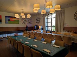 a conference room with a long table and chairs at Mercure Aix-En-Provence Sainte-Victoire in Châteauneuf-le-Rouge +125 photos