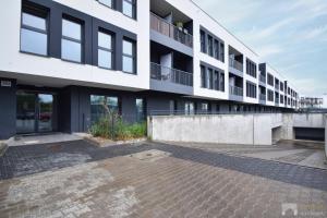 a large white building with a lot of windows at Apartament Szmaragd&Perła by LookAp - parking gratis! in Poznań