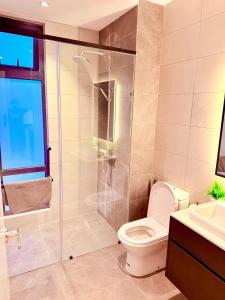 a bathroom with a shower and a toilet and a sink at AXON RESIDENCE BUKIT BINTANG KLCC by FIRST CLASS in Kuala Lumpur