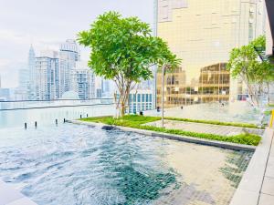 a swimming pool in the middle of a city with buildings at AXON RESIDENCE BUKIT BINTANG KLCC by FIRST CLASS in Kuala Lumpur