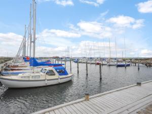 a group of boats docked at a dock in the water at Holiday Home Eisa - 300m to the fjord by Interhome in Øsløs