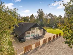 an overhead view of a small house with a patio at Holiday Home Eisa - 300m to the fjord by Interhome in Øsløs