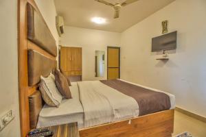 TV a/nebo společenská místnost v ubytování Hotel Flamingo