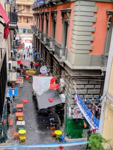 an overhead view of a street with chairs and tables at Incoming Quartieri Spagnoli in Naples +53 photos