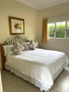 Postel nebo postele na pokoji v ubytování 3D Annie's Place Rawdons Country Estate