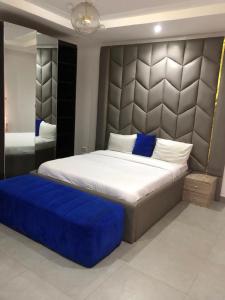 Ένα ή περισσότερα κρεβάτια σε δωμάτιο στο Baels Suites +5 φωτογραφίες