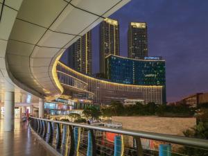 a view of a city skyline at night at Pullman Jakarta Central Park in Jakarta
