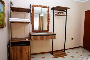 a bathroom with a mirror and a sink at Vila 15 By Nam Nam Tirane in Tirana +104 photos