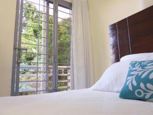 Ένα ή περισσότερα κρεβάτια σε δωμάτιο στο Majestic View Apartment II