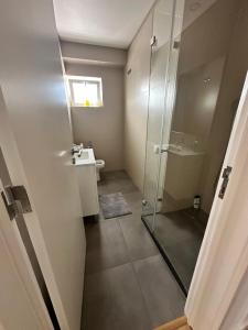 a bathroom with a shower and a sink at CASCAIS.IO in Cascais